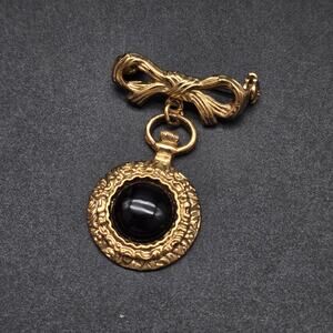 1928 Brand Gold Tone Bow Brooch Black Cabochon Charm Vintage Jewelry